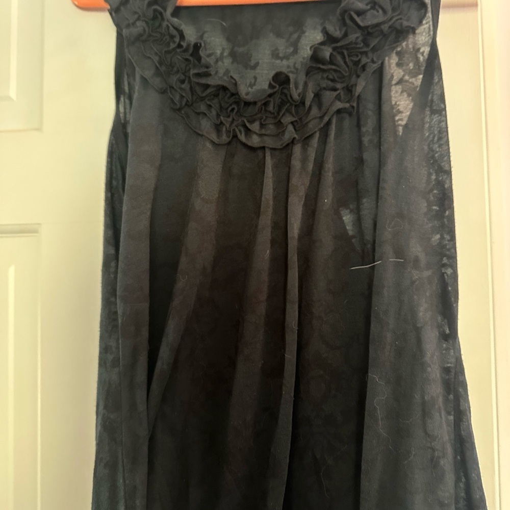 Black Ruffled Sheer Top size large
By Testament